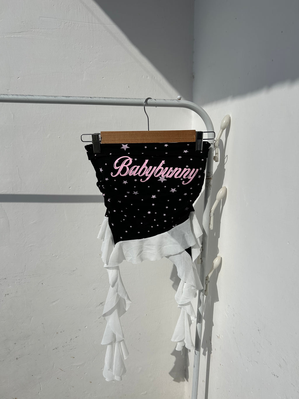 Built in padded tube top with ruffles.