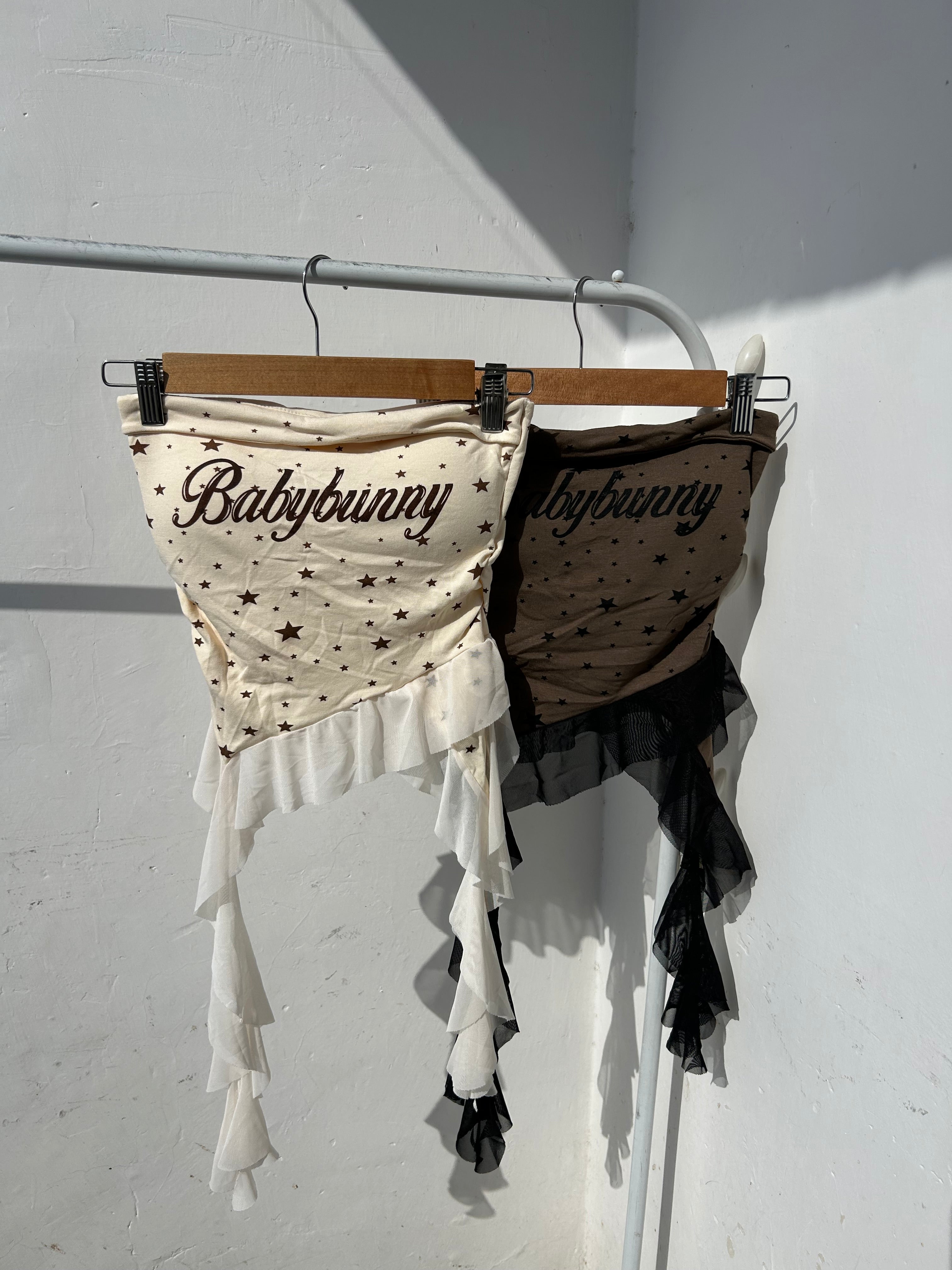 Built in padded tube top with ruffles.