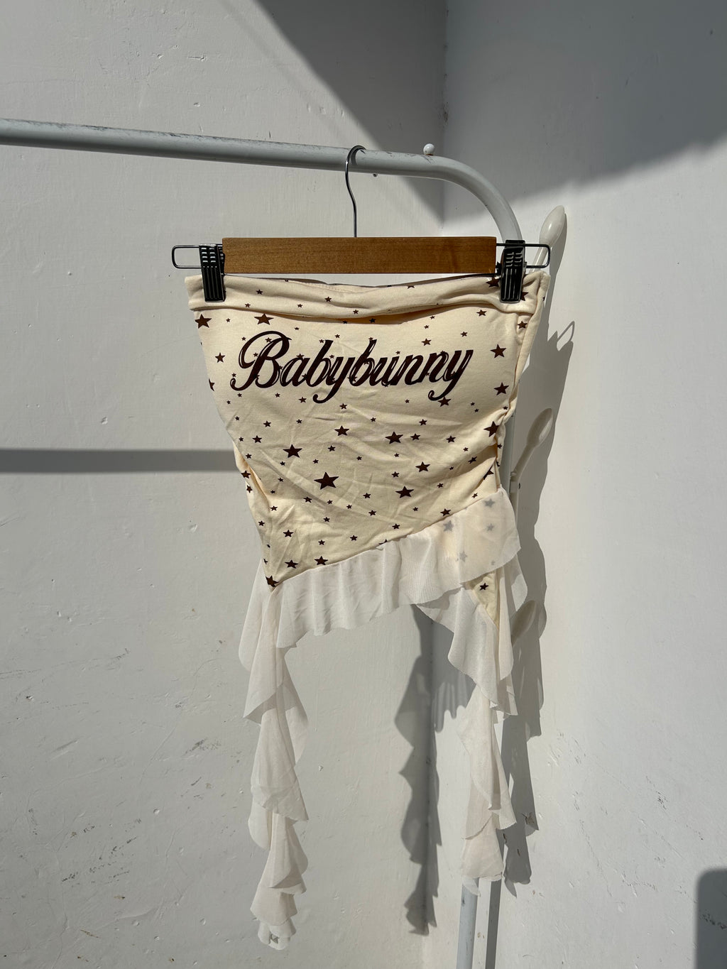 Built in padded tube top with ruffles.